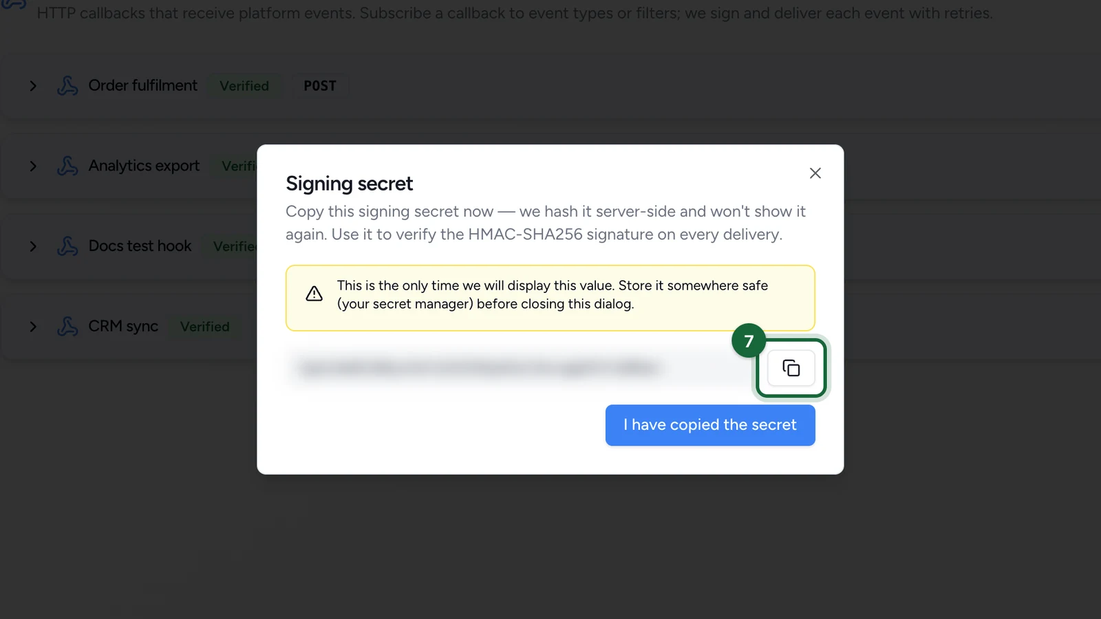 Signing secret window, the value blurred here, with the copy button highlighted